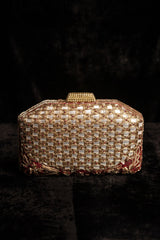 A hand embroidered mirror clutch